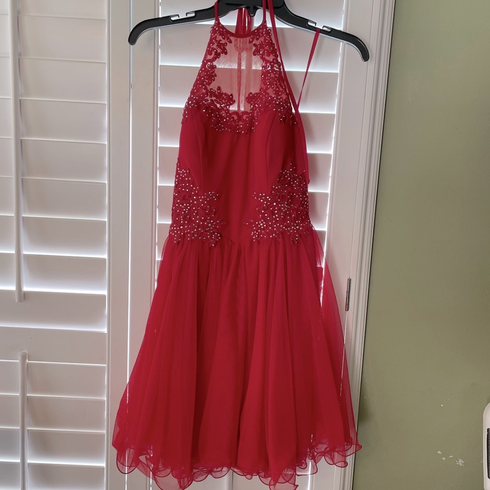 Red halter Homecoming or party dress with embellishments. Worn once.  Size 1